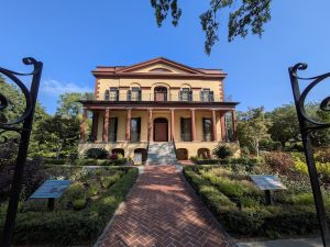 Hampton-Preston Mansion and Gardens at Congaree National Park, a two-story villa with a brick path and formal garden.