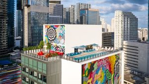 Rooftop pool on a mural-covered Brickell building in downtown Miami, within proximity to Biscayne National Park.