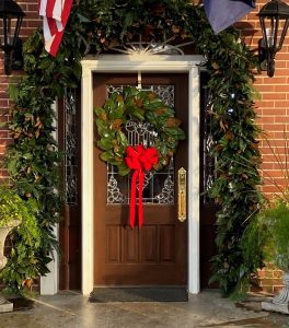 Gift shop entrance at Congaree National Park decorated with a wreath and flags.
