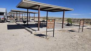 Picnic shelter and picnic tables at a desert campground in Carlsbad Caverns National Park’s Sunset Reef area.