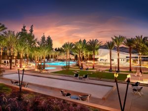 Pool area at a Westlake Village resort with palm trees and a sunset sky near Channel Islands National Park