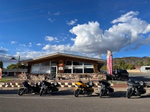 Lodge-style motel building in Capitol Reef National Park with several motorcycles parked in front.