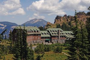 Crater Lake Lodge sits along Crater Lake National Park's rim, a stone-and-wood lodge framed by pines.