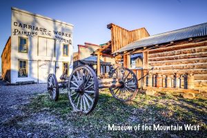 Historic storefronts and a wooden wagon wheel display sit outside the Museum of the Mountain West in Black Canyon Of The Gunnison National Park.