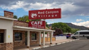Lodging complex near Bryce Canyon National Park with cafe signage and stone facade.