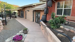 Lodge exterior at a Moab lodging near Canyonlands National Park, showing guest entry and courtyard.