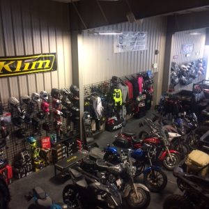 Gift shop interior at Black Canyon of the Gunnison National Park, showcasing motorcycle gear and apparel.