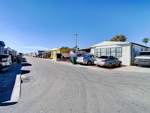 Lodging street scene with mobile homes and parked cars in Biscayne National Park, near a residential lodging area.