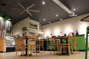 Bagel shop interior inside Black Canyon of the Gunnison National Park, with wooden tables and a lime-green counter.