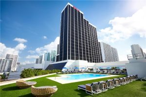 Rooftop pool at a downtown Miami hotel with skyline views over Biscayne National Park.