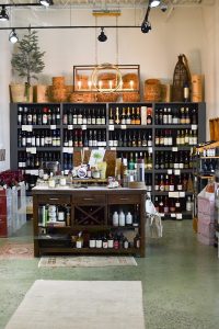 Gift shop interior at Congaree National Park featuring wine bottles, wares, and rustic display.