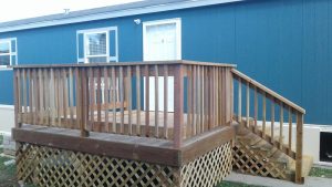 Blue lodging unit with a raised wooden deck in Black Canyon of the Gunnison National Park.