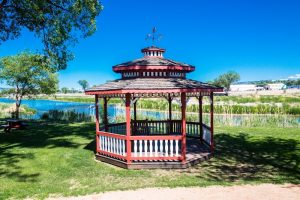 Red wooden gazebo along the Gunnison River in Black Canyon Of The Gunnison National Park.