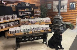 Inside the Black Canyon Of The Gunnison National Park gift shop, jerky and souvenirs fill rustic shelves beside a wood stove.