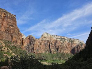 Upper Emerald Pool trail winds through Zion National Park's red rock canyon, offering shaded pools and dramatic cliffs.