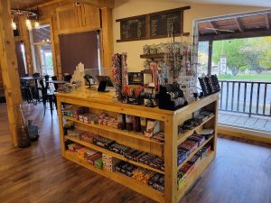 Gift shop interior Bryce Canyon National Park lodge, featuring wooden shelves and a variety of souvenirs.