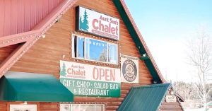 Chalet-style restaurant building at Bryce Canyon National Park, a timber lodge with green awnings and string lights.