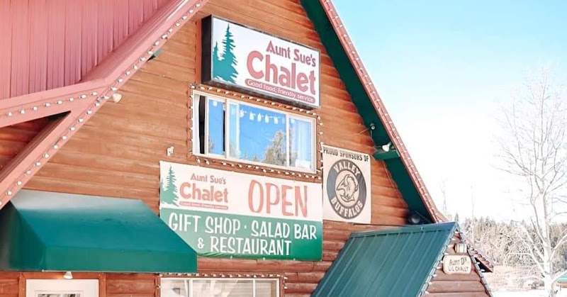Chalet-style restaurant building at Bryce Canyon National Park, a timber lodge with green awnings and string lights.