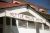 Photograph of rustic wooden sign on building front with "Kettle Falls Hotel" painted in red.