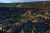 Lava flows and ferns in front of a cliff at sunset