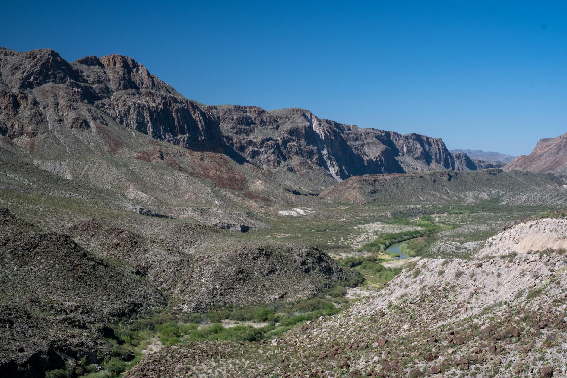 Explore the breathtaking landscape of Terlingua Valley, Texas with dramatic rocky mountains.
