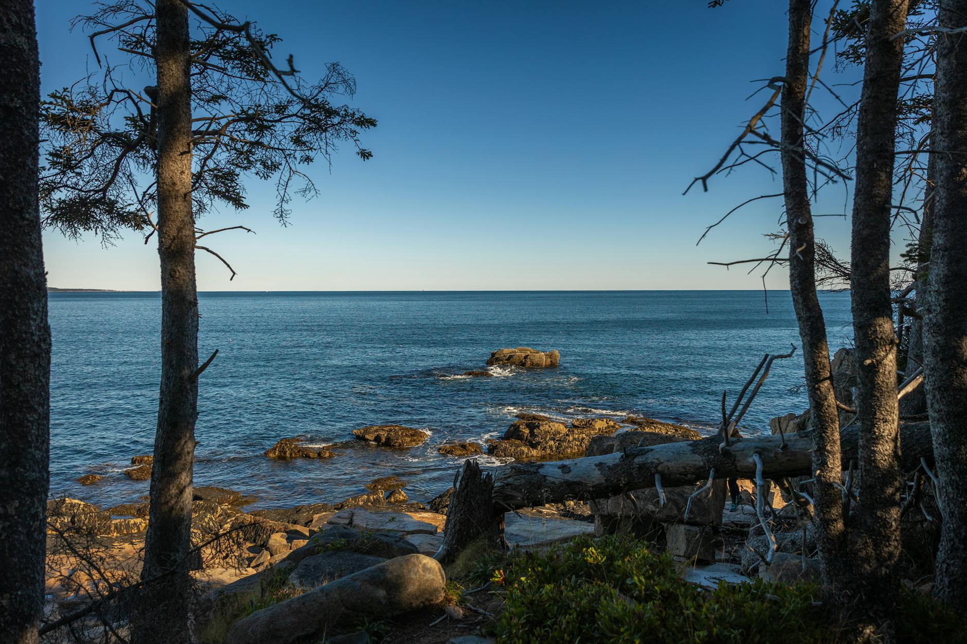 Stunning seascape from Maine's coastline, featuring rocky shores and serene ocean views.