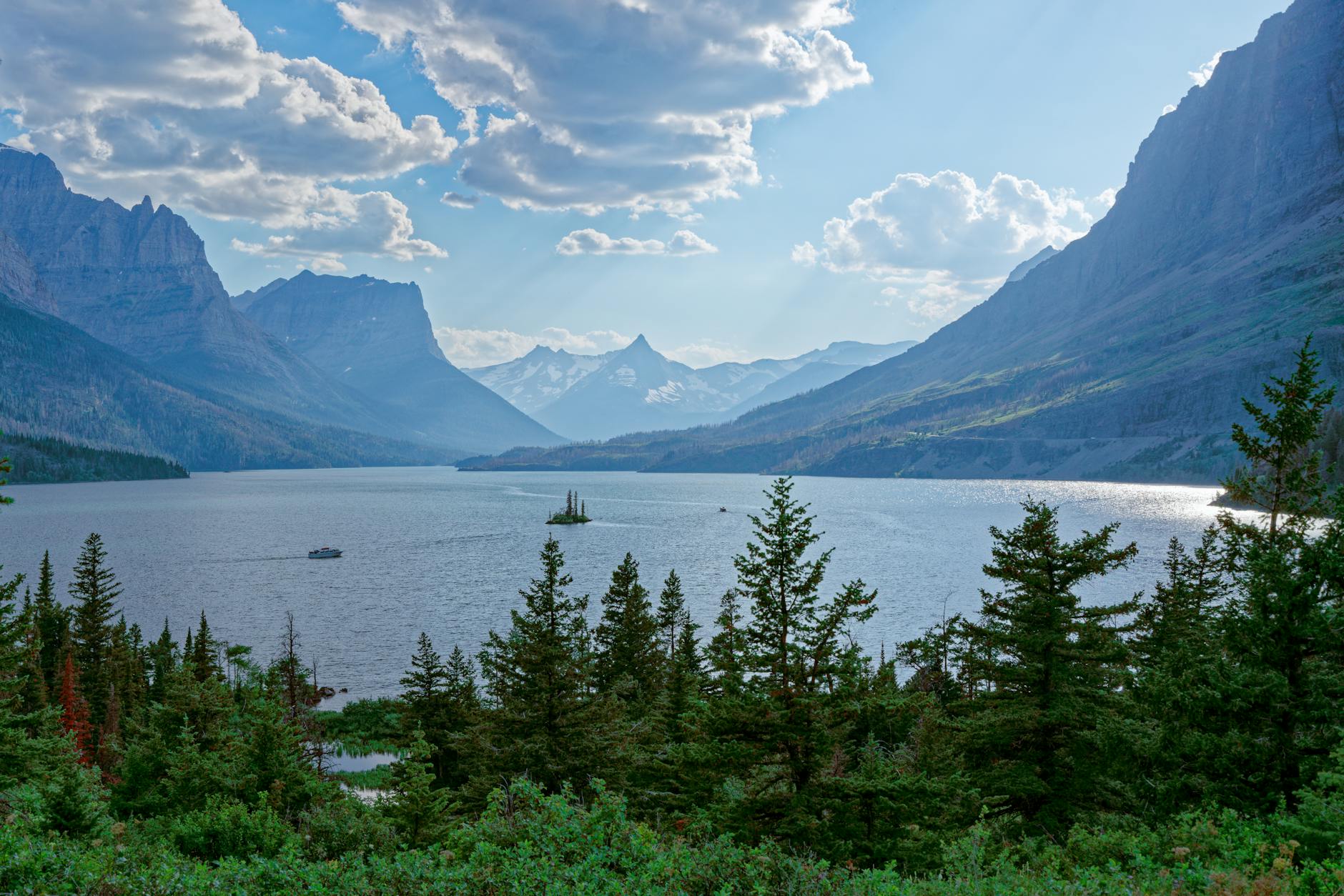 Breathtaking view of Saint Mary Lake surrounded by majestic mountains in Glacier National Park, Montana.