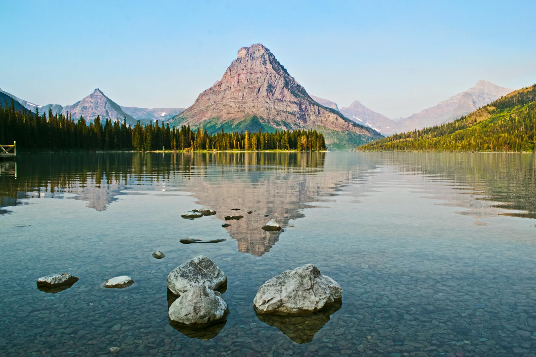 A serene lake with mountain reflections, capturing nature's calm beauty.
