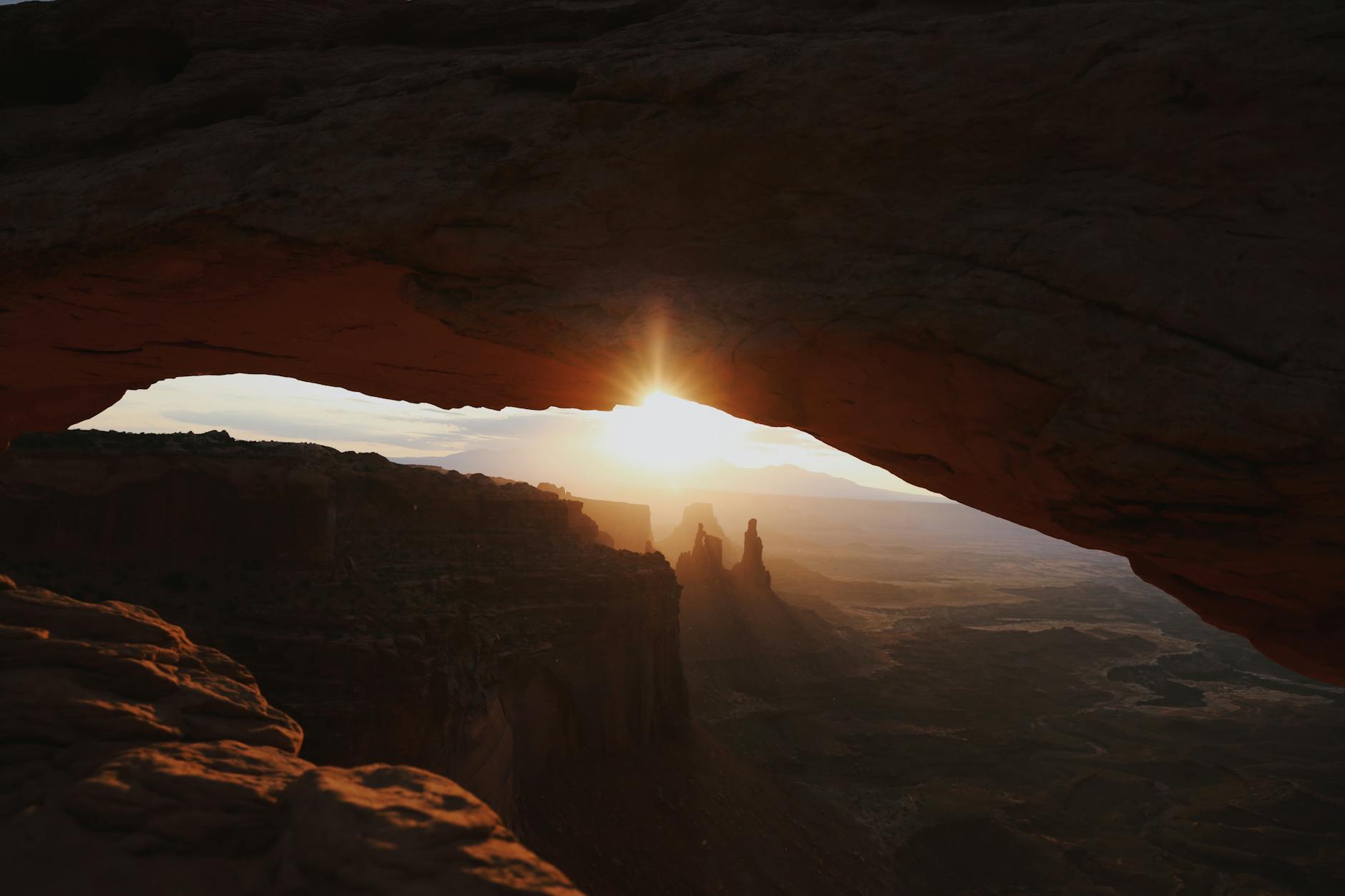 Stunning sunrise view through Mesa Arch in Canyonlands National Park, Utah.
