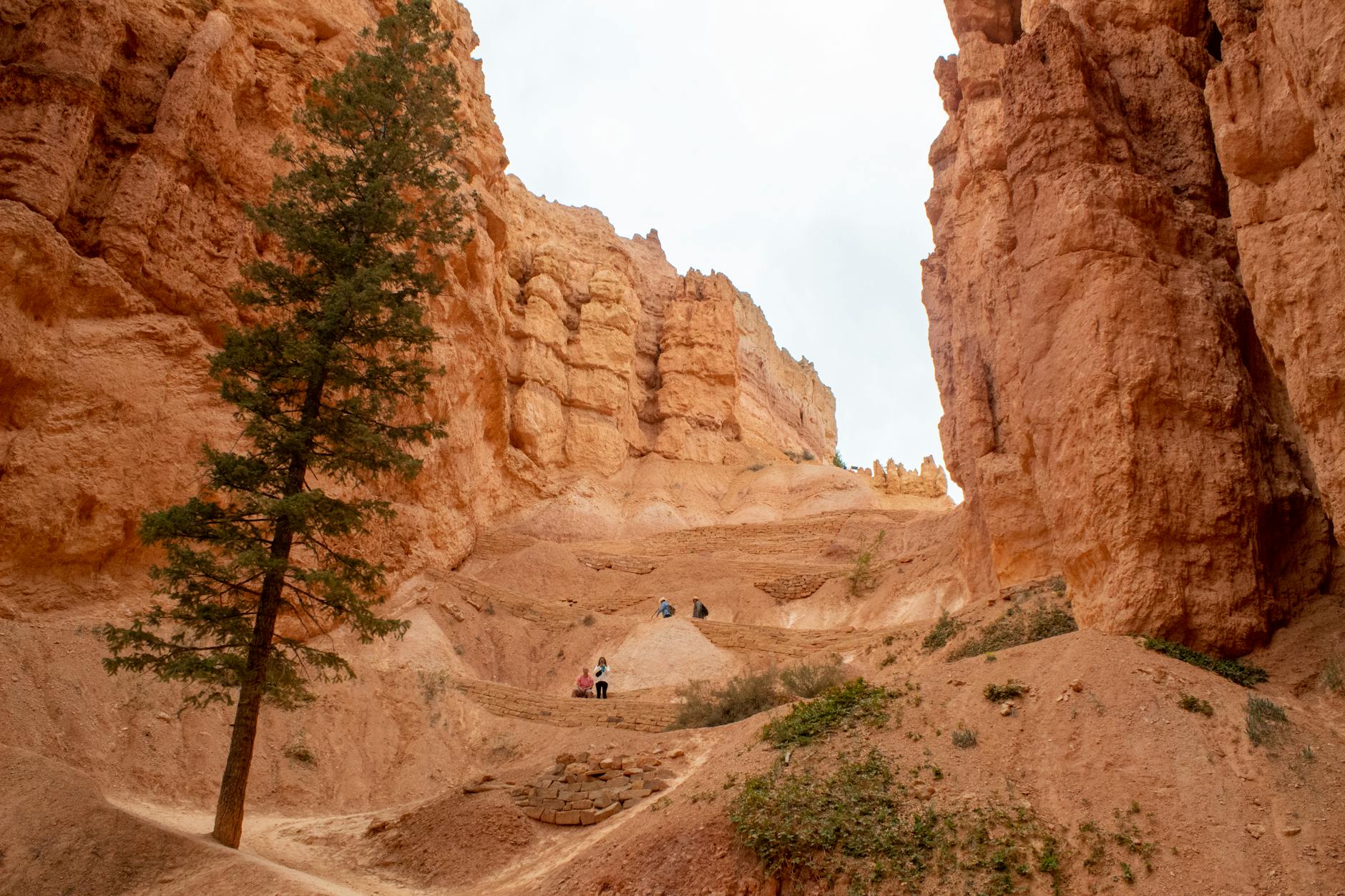 Adventurers hiking the iconic landscapes of Bryce Canyon National Park.