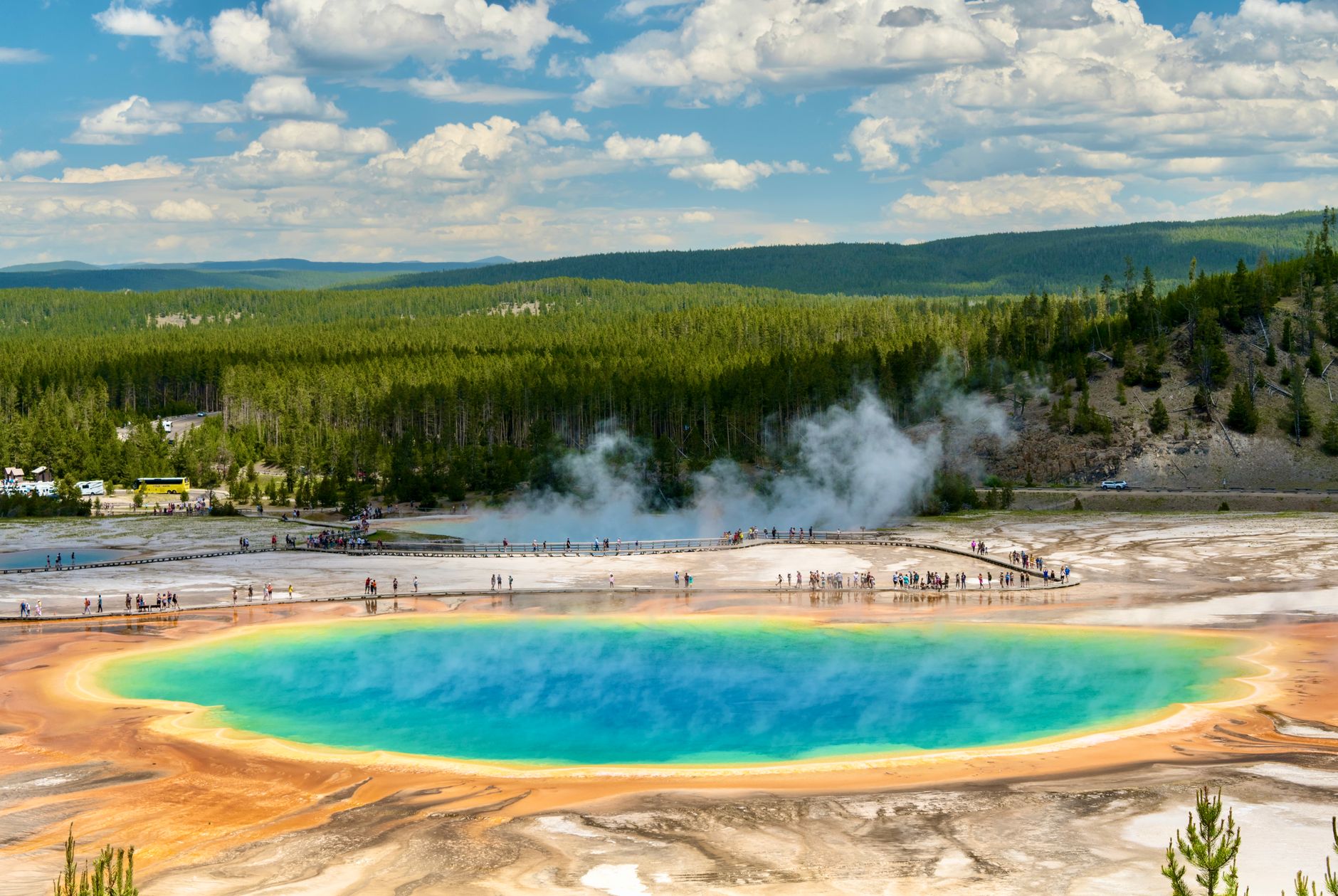 Aerial view of the vibrant Grand Prismatic Spring in Yellowstone National Park, showcasing natural geothermal beauty.