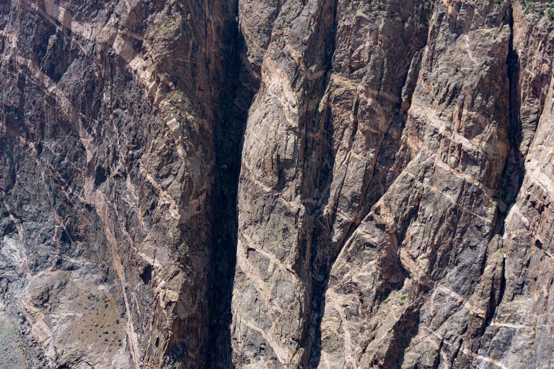 A breathtaking aerial view of the Black Canyon's rugged terrain in Gunnison, Colorado.