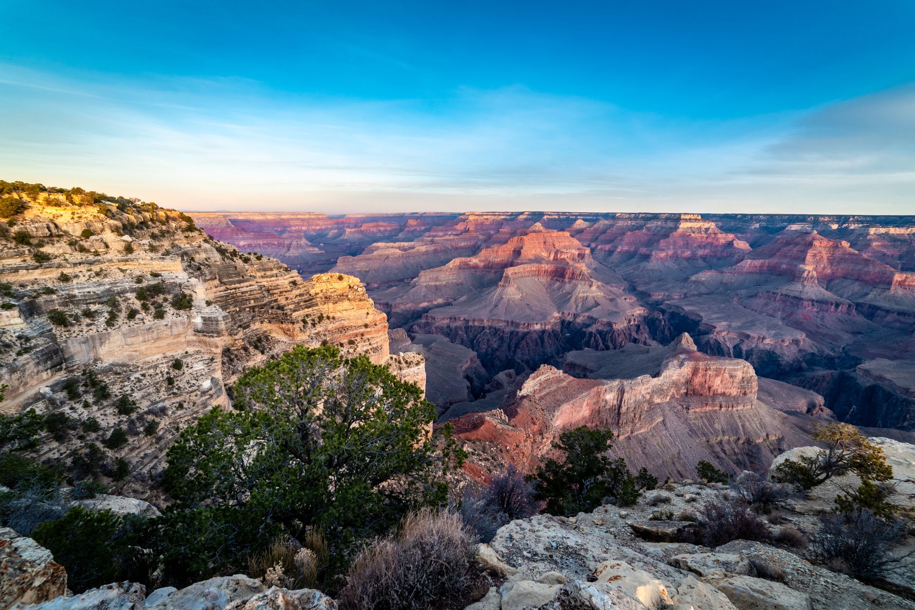 Breathtaking sunrise view of the Grand Canyon, Arizona showcasing its dramatic landscapes and vibrant colors.