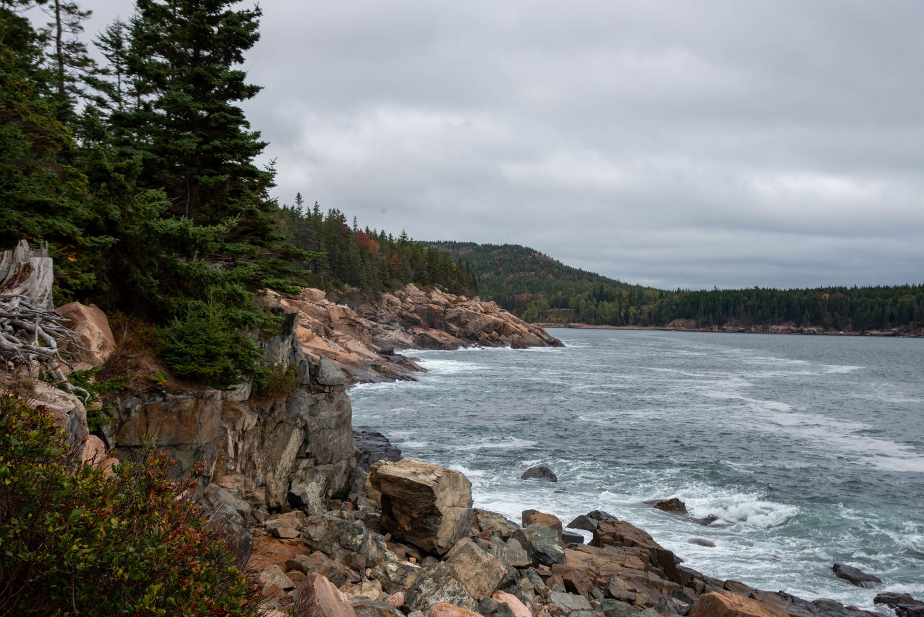 Stunning view of the rocky coastline in Acadia National Park, Maine, during fall.