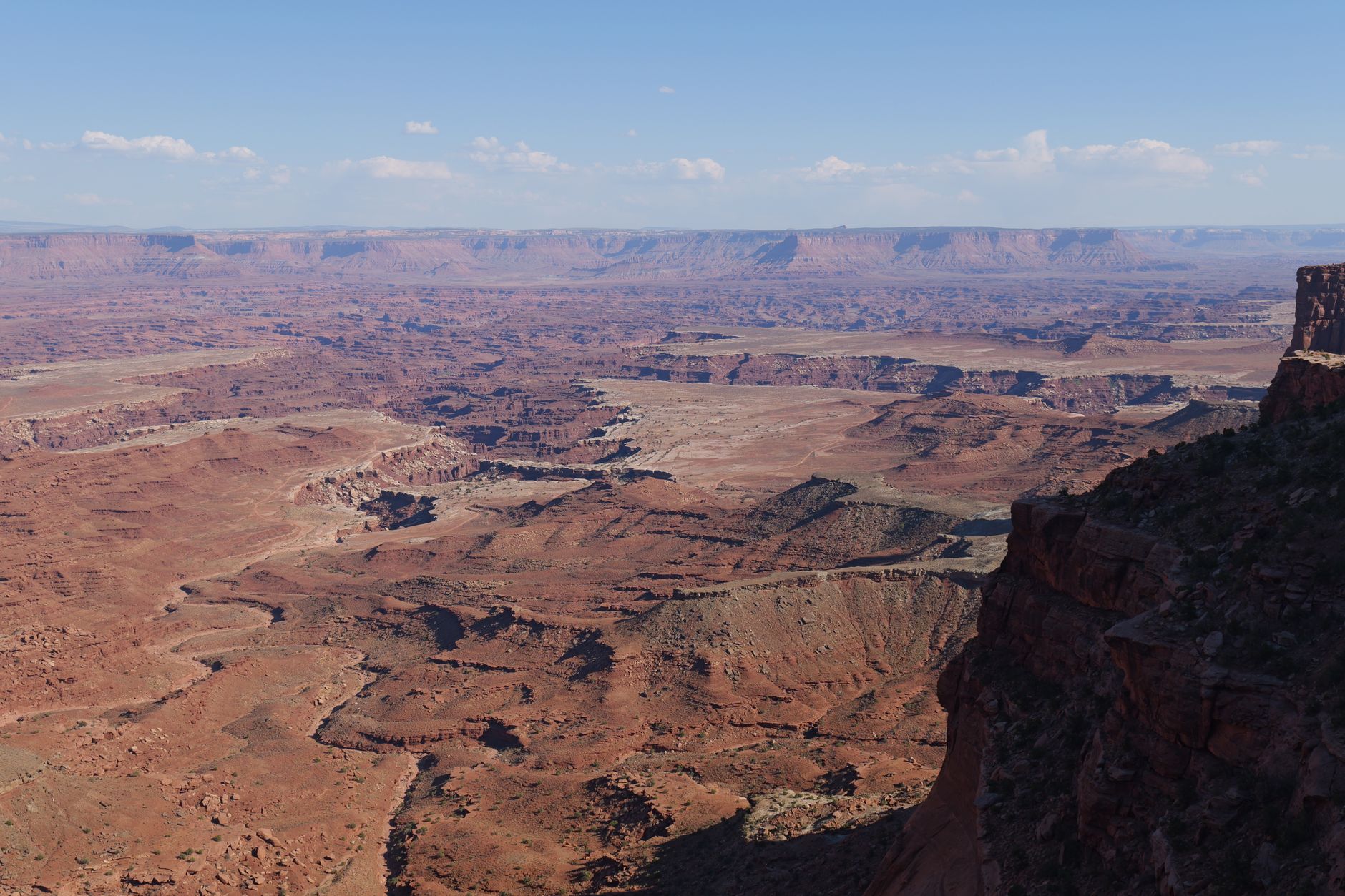 Explore the vast, rugged landscape of Canyonlands National Park. Stunning aerial view.
