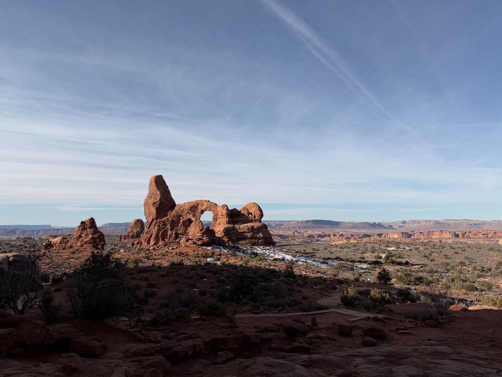 Explore the breathtaking rock formations at Arches National Park under a clear blue sky.
