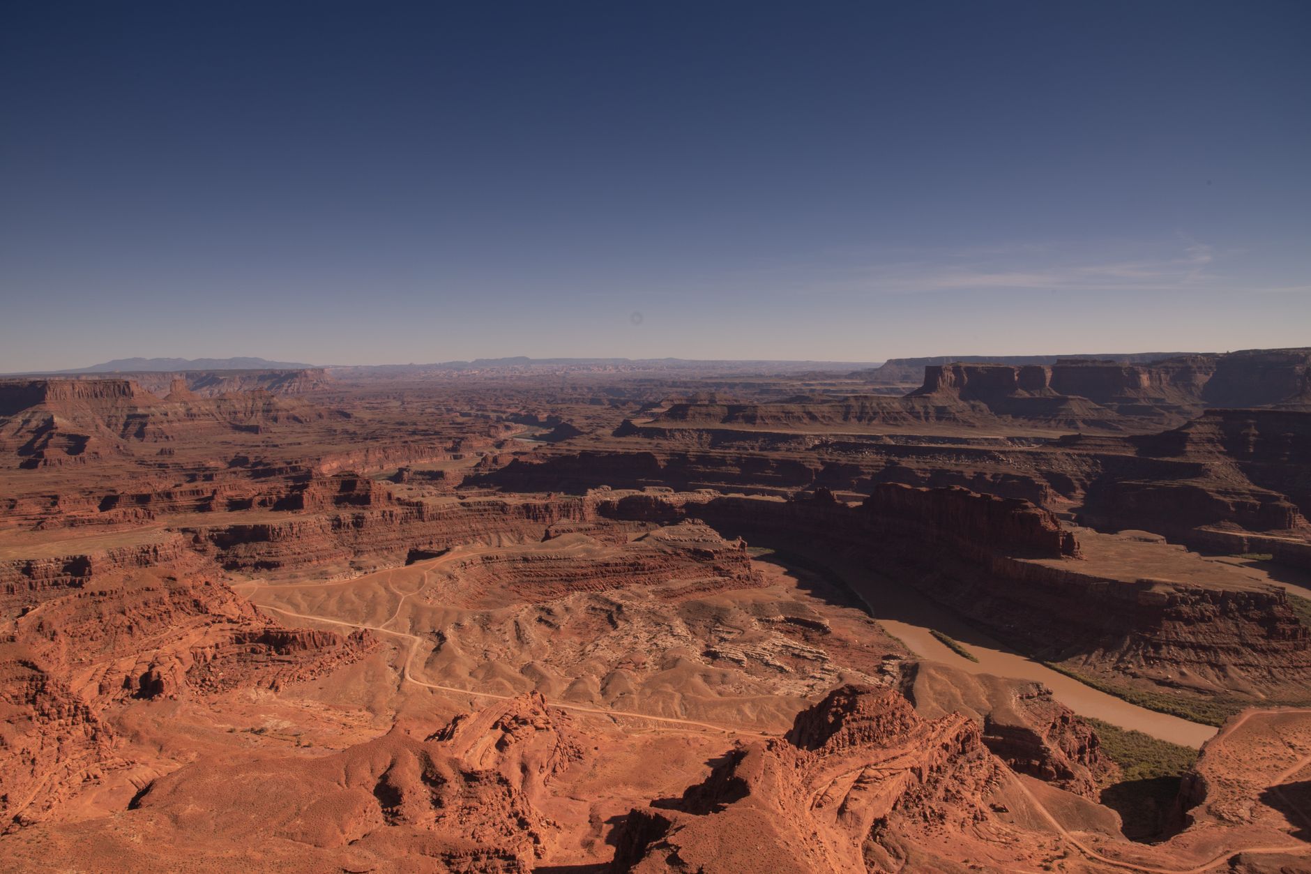 A breathtaking aerial view of red rock canyons in Canyonlands National Park, Utah, showcasing natural erosion and geological formations.