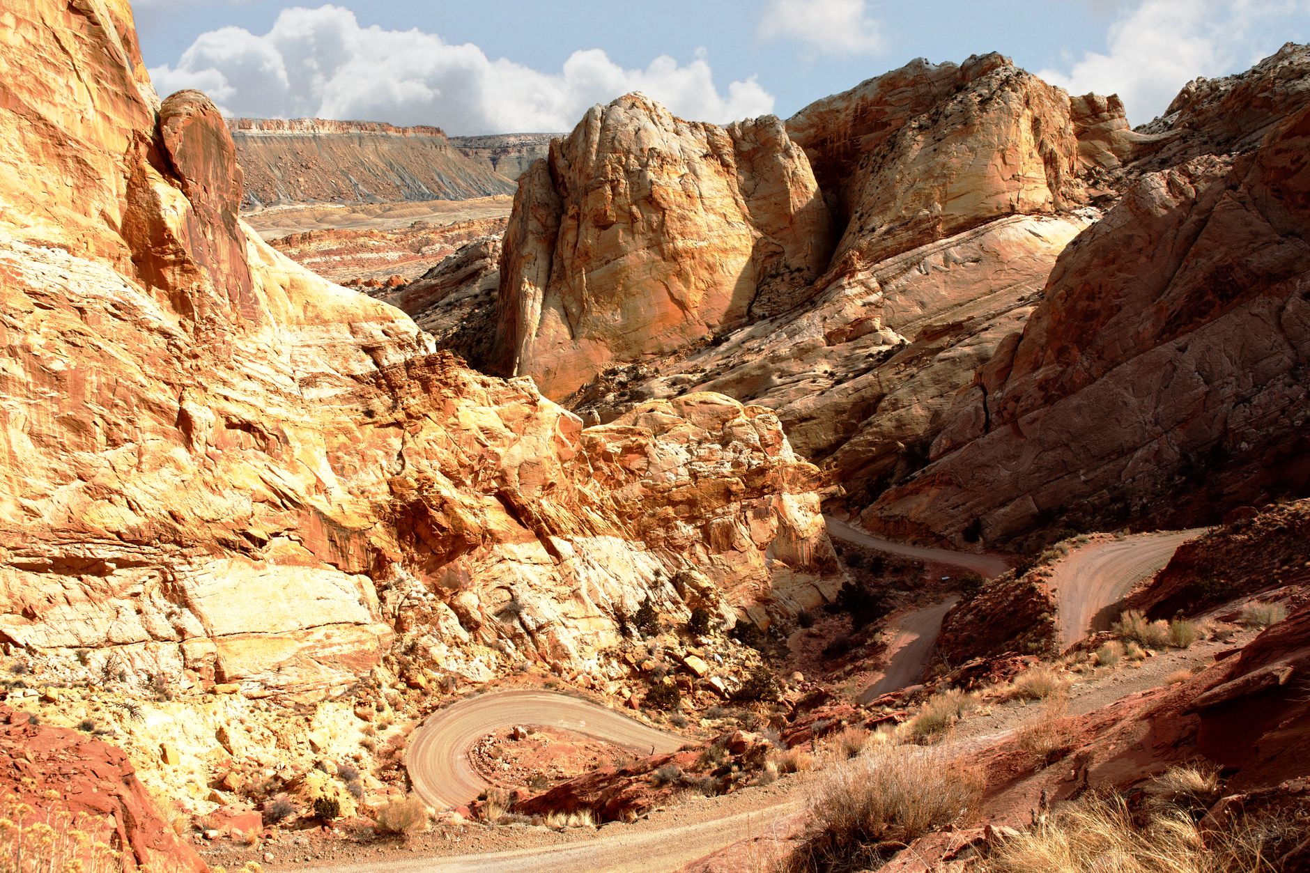 Captivating view of Burr Trail switchbacks amidst rugged desert rock formations in Utah.
