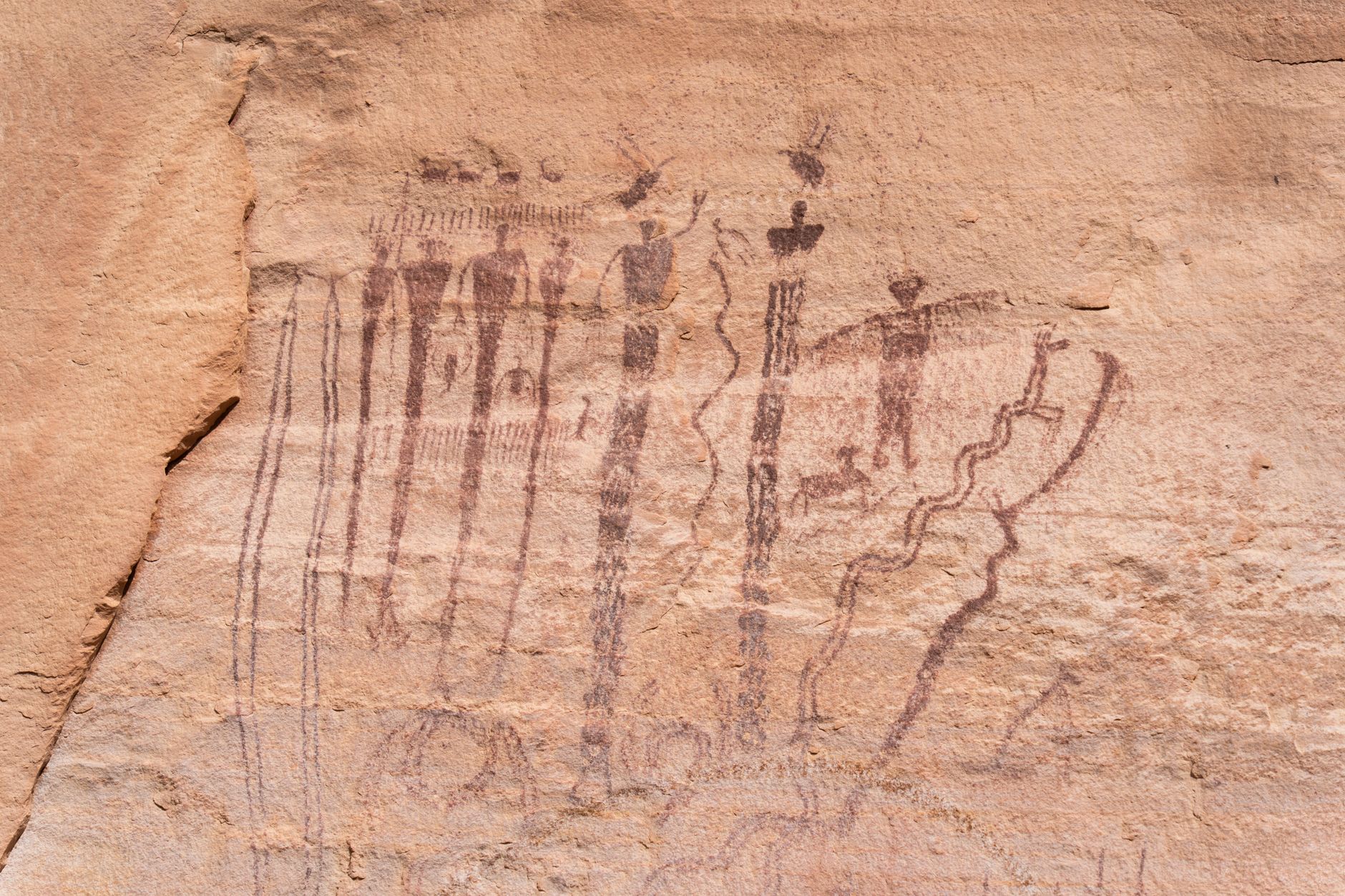 Explore ancient petroglyphs on a Utah cliff, reflecting Native American art and culture.