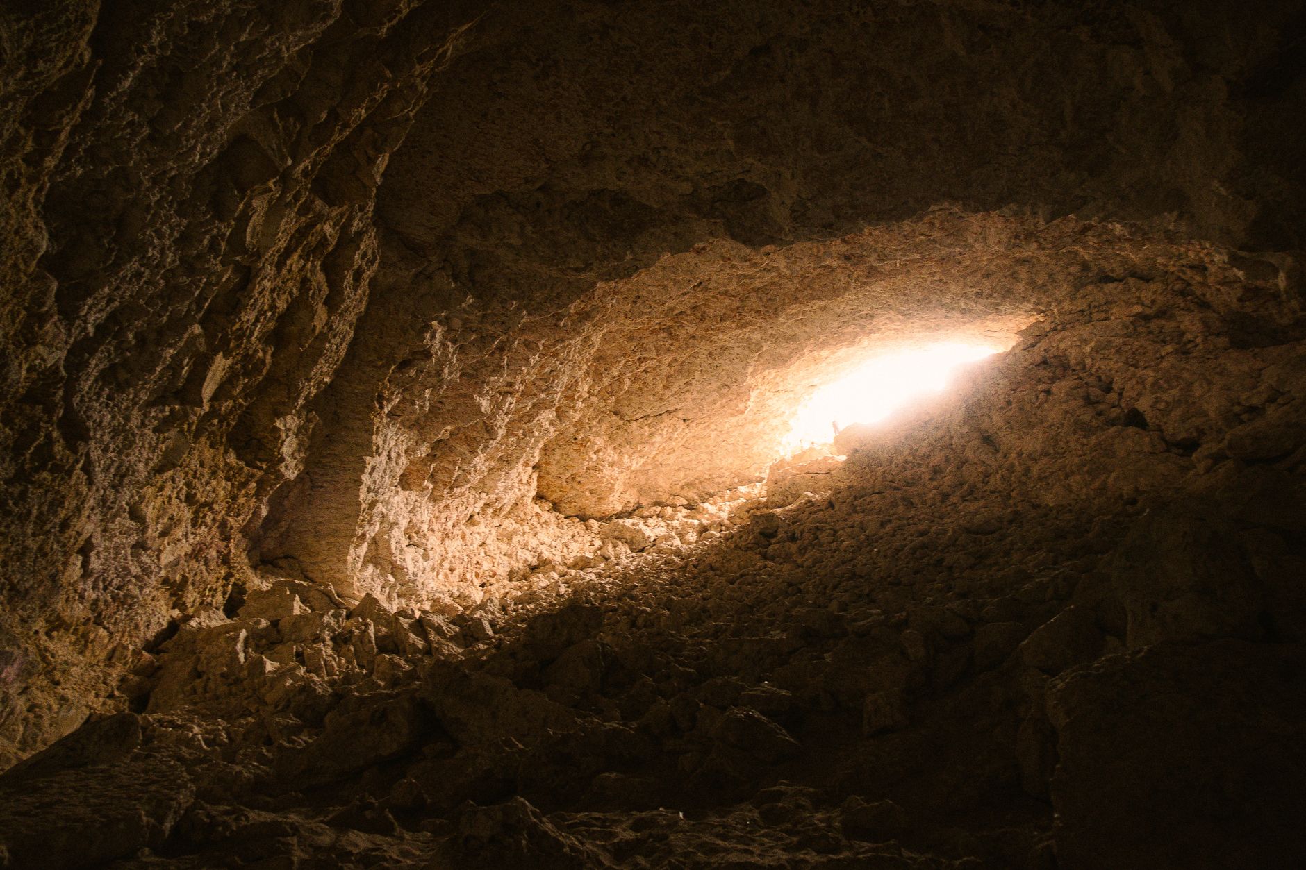 A captivating view of light streaming into a rocky cave, showcasing natural geology.