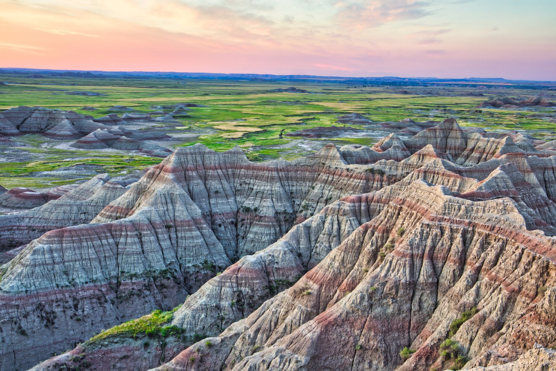 Captivating sunset over the unique landscapes of Badlands National Park, South Dakota.