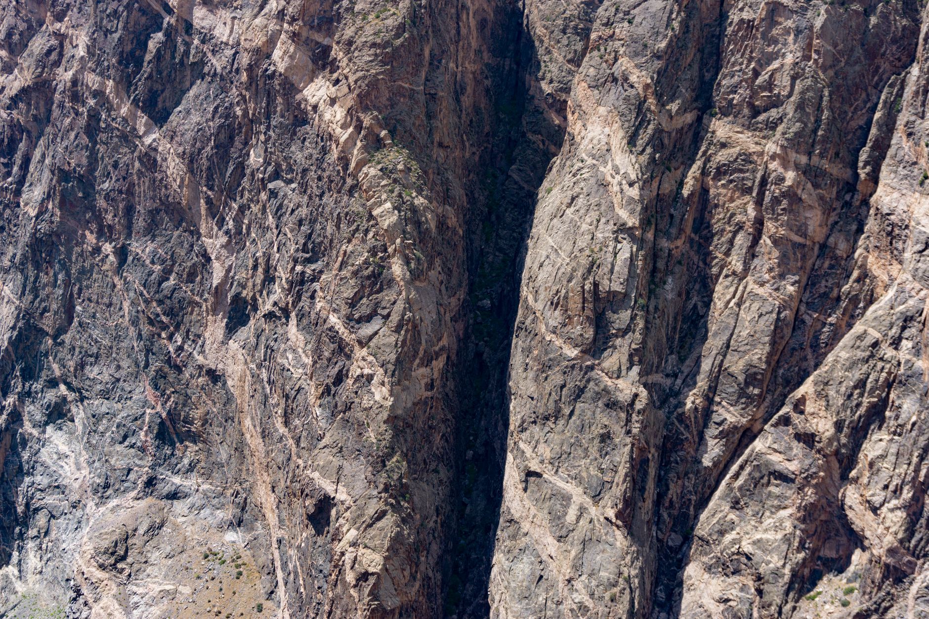 A breathtaking aerial shot of the rugged canyon landscape in Gunnison, Colorado, showcasing intricate rock formations.