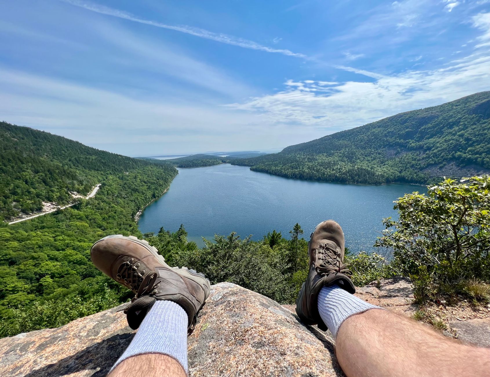 Relaxing feet overlooking Jordan Pond in Acadia National Park, Maine, USA.