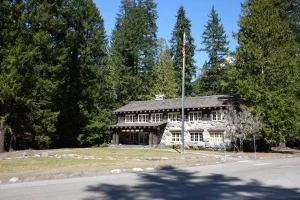 A two-story wood and rock building.