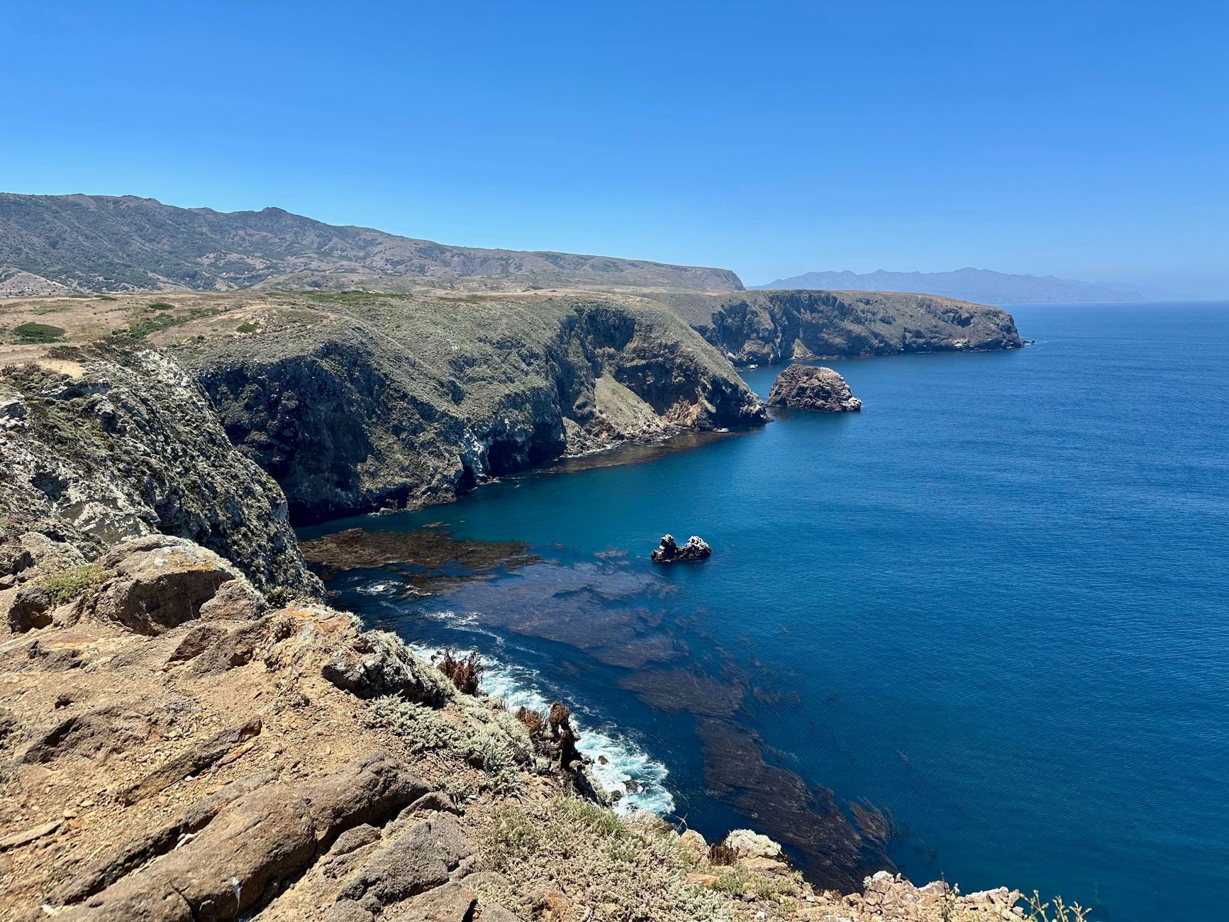 Stunning view of the rugged coastline at Santa Cruz Island, California, with clear blue ocean waters.