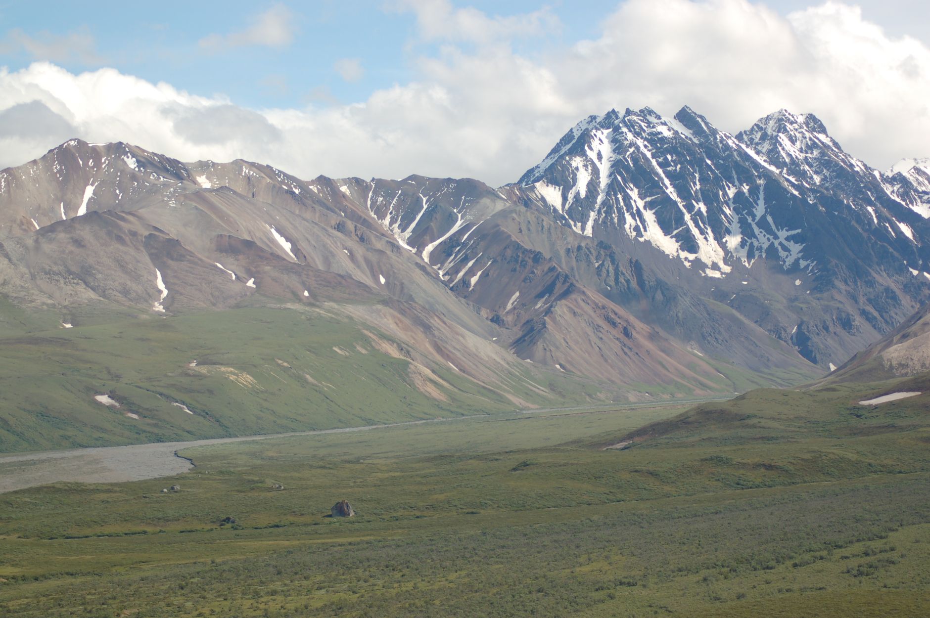Explore the breathtaking snow-capped mountains and lush valleys, capturing nature's scenic beauty.