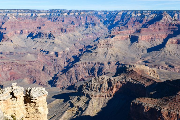 Experience the awe-inspiring view of the Grand Canyon's vast and majestic terrain.