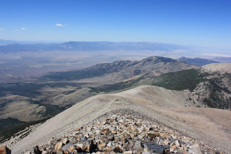 A breathtaking view of the mountains from Wheeler Peak, showcasing the vast landscape of Baker, Nevada.