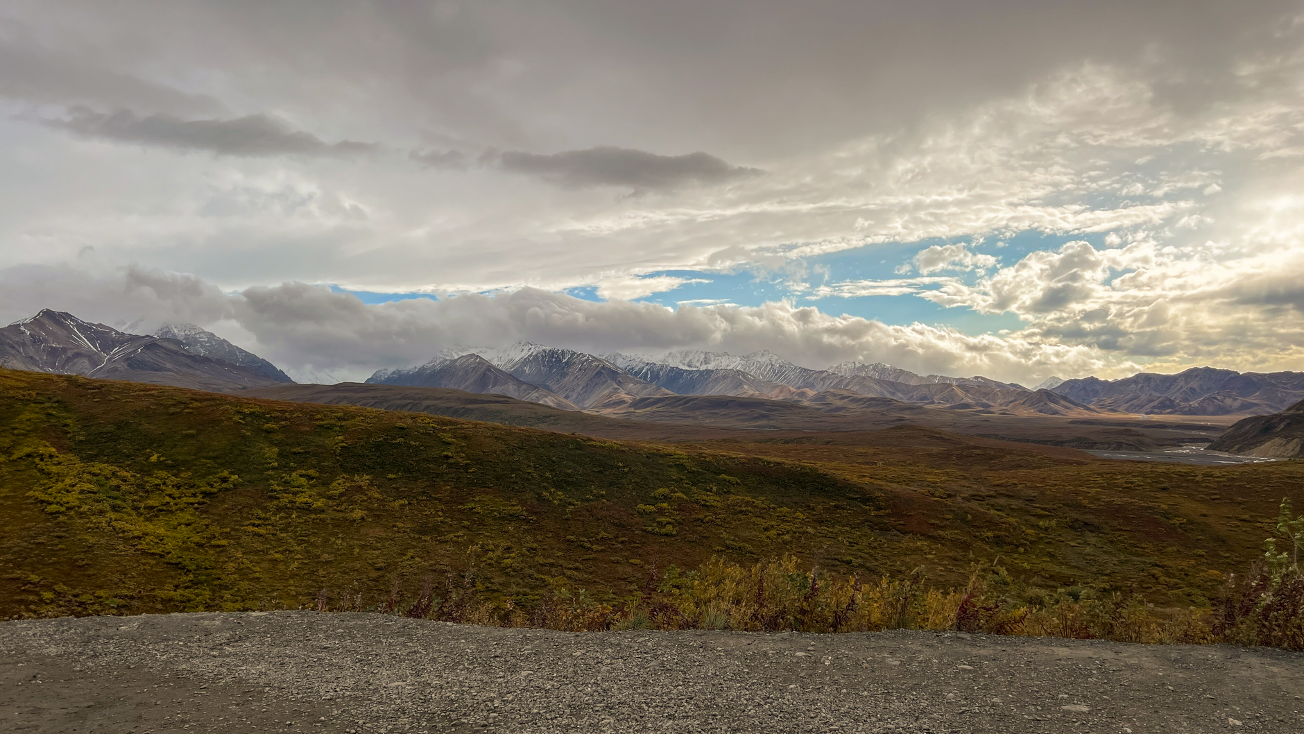 Breathtaking view of Denali National Park's rugged mountains and vast valleys in fall.
