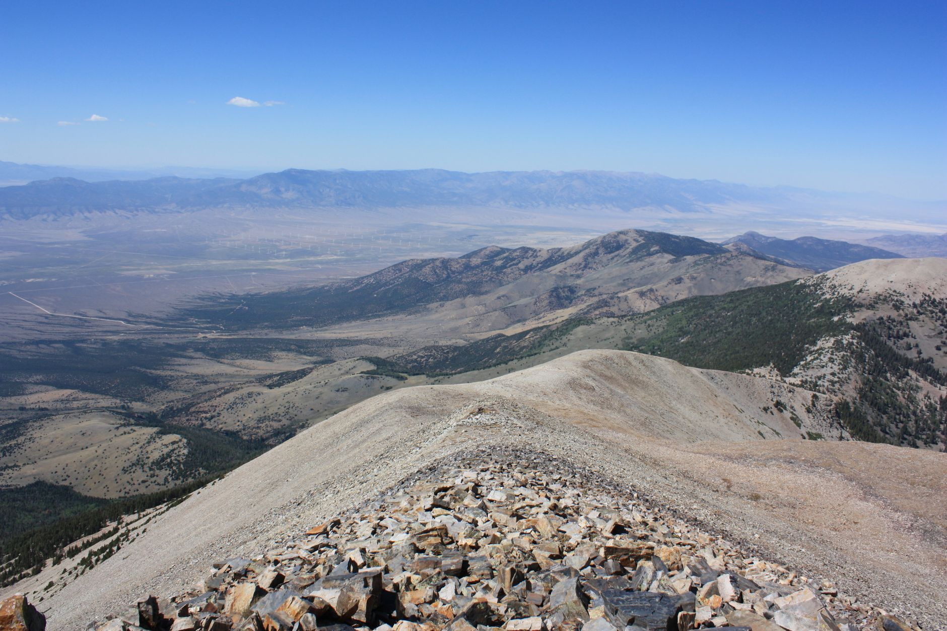 A breathtaking view of the mountains from Wheeler Peak, showcasing the vast landscape of Baker, Nevada.